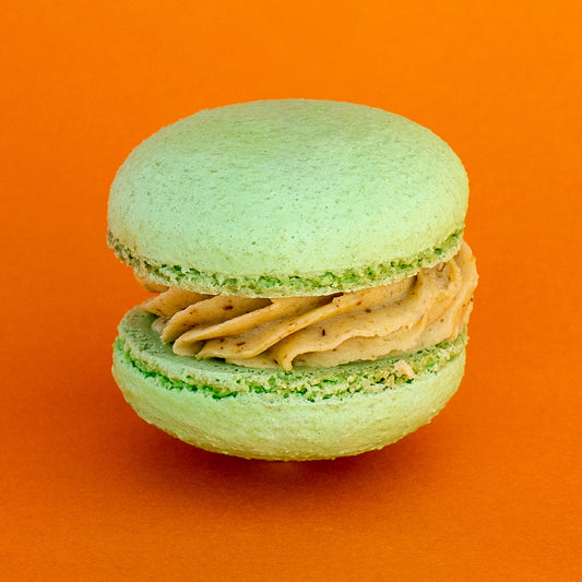 Pistachio Raspberry Macaron: Delicate green macaron shell with smooth pistachio ganache and fresh raspberry filling. Perfect for macaron lovers seeking a balanced nutty and fruity flavor combination.